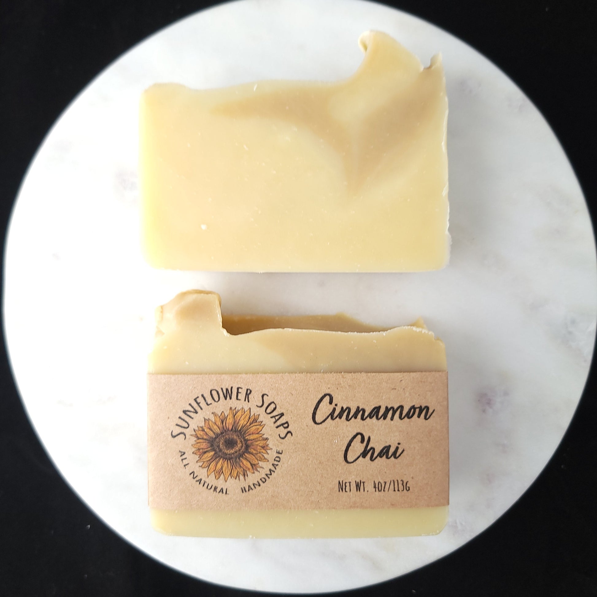 Bar of soap with a visible brand label on a white marble surface