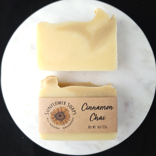 Bar of soap with a visible brand label on a white marble surface