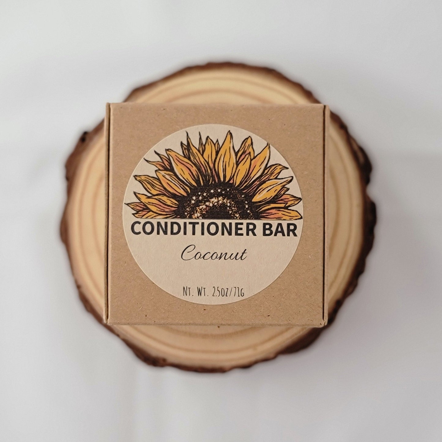 Conditioner bar packaging with sunflower design on a wooden block