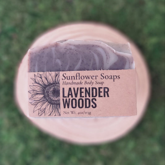 Bar of lavender soap with a Sunflower Soaps label on a green grass background